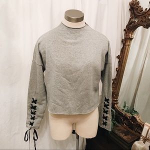 Gray cropped sweatshirt with lace up sleeves